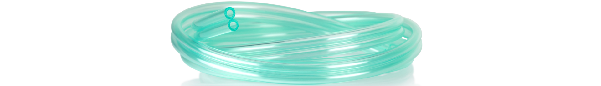 Coiled transparent greenish PVC medical tubing, designed for oxygen delivery, suction, and general fluid transfer in clinical environments.